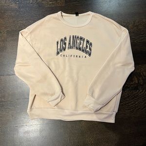 Los Angeles dusty yellow sweatshirt.